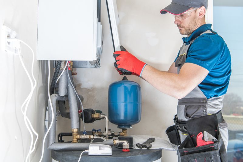Technician Performing Pilot Light Maintenance